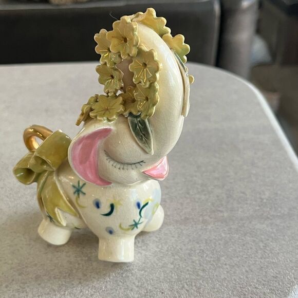 A decorated Elephant? Ceramic. Pink ears. Nose in air. Flowers on trunk. Eyelash - Picture 1 of 14